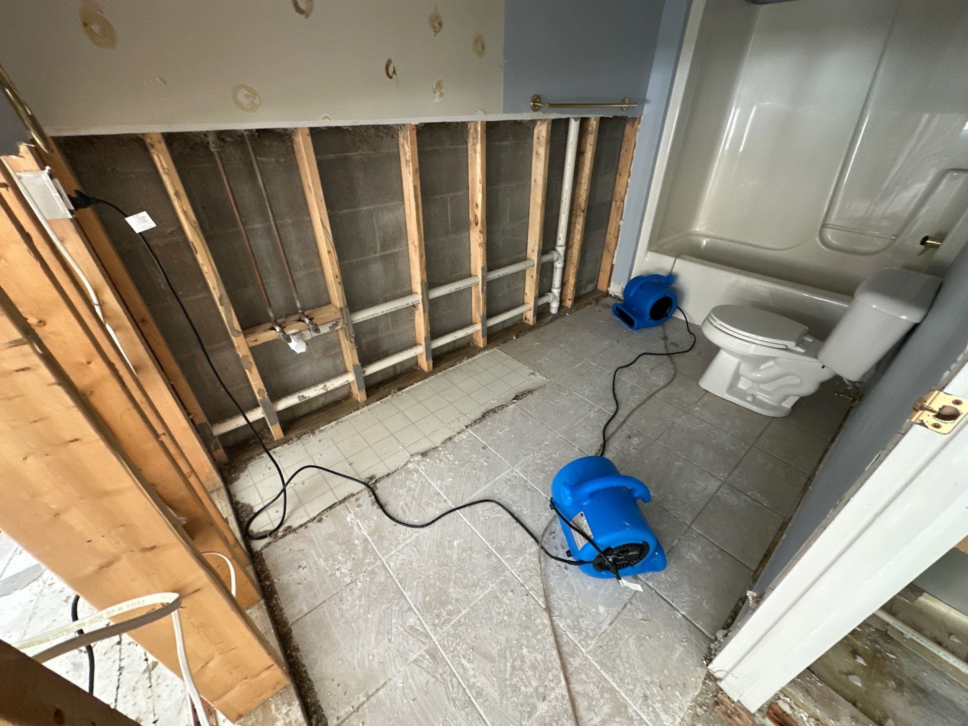 Mold Warrior air scrubber and containment drying a Columbus water-damaged room